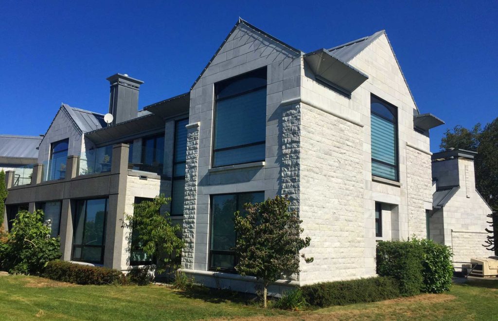 modern residential home with stone siding